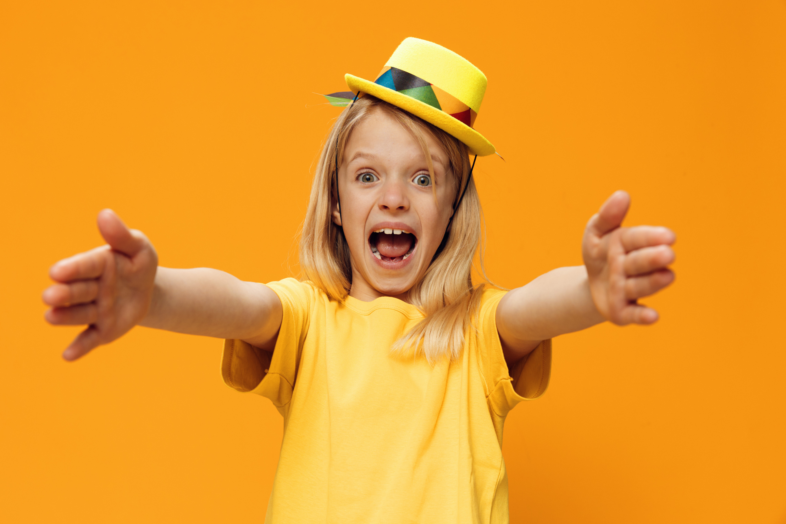 1 portrait-girl-screaming-while-standing-against-yellow-background.jpg