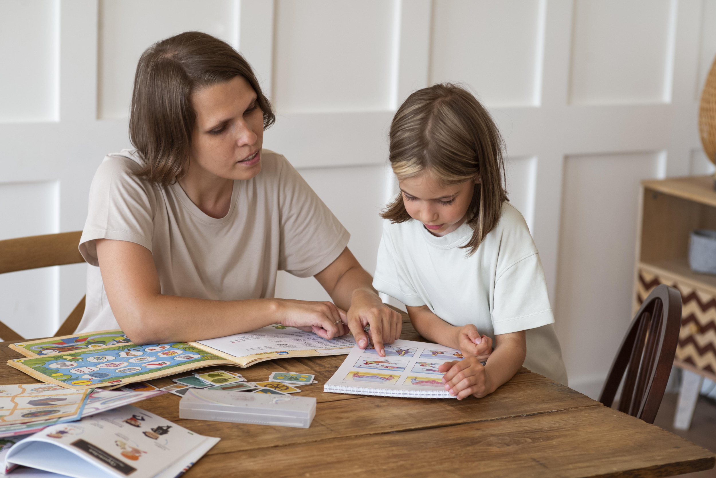 woman-helping-girl-study-medium-shot.jpg