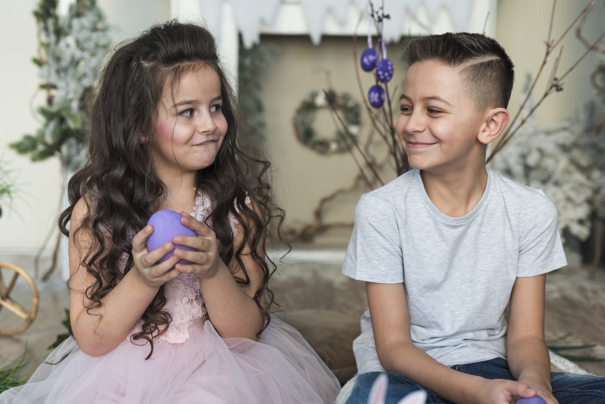 1 cute-boy-girl-sitting-with-easter-eggs.jpg